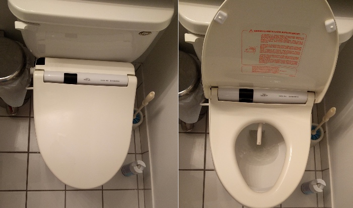 The installed toilet, with the wand exposed in the right 